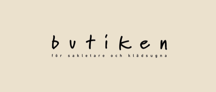 Butiken för sakletare och klädsugna, logotyp